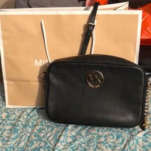 Black and gold Michael Kors cross body purse